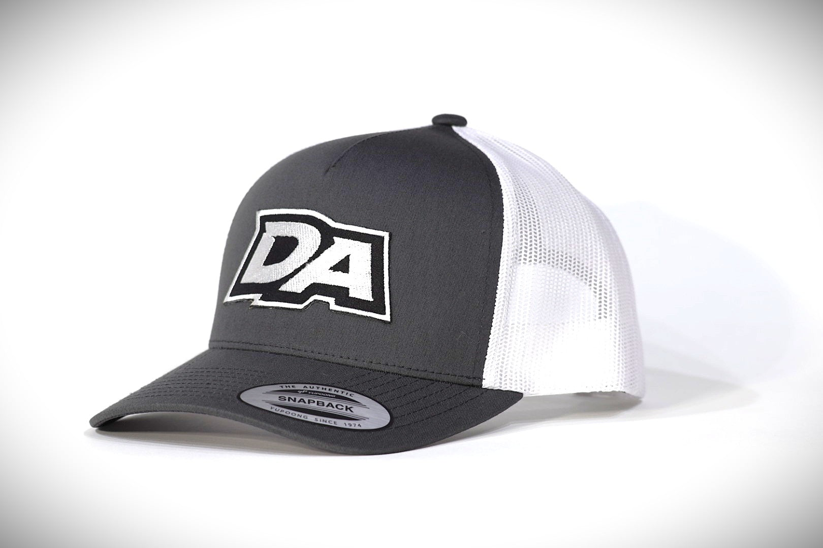 DA Logo Series Yupoong Trucker Hat – Charcoal/White