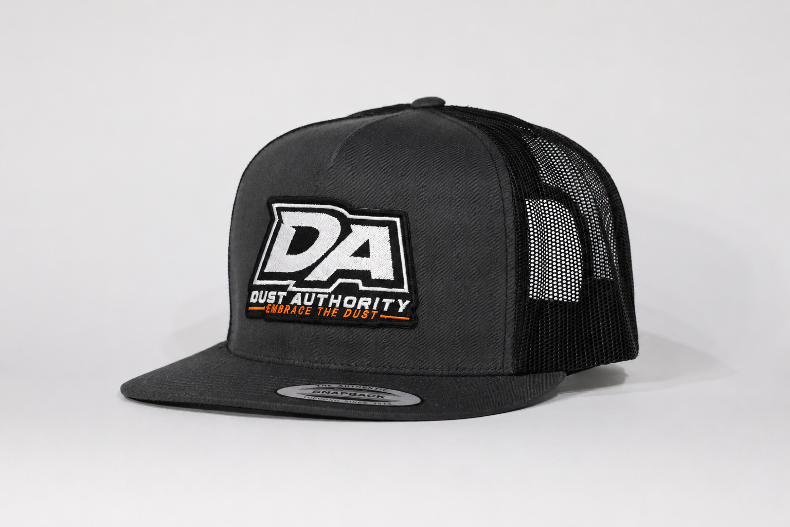 DA Embrace the Dust Series Yupoong Trucker Hat – White/Black